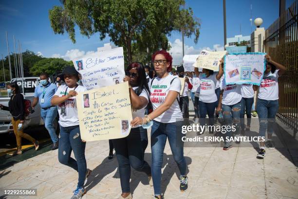 Acid attack survivors take part in a protest and press conference outside the National Congress in Santo Domingo, October 24, 2020 claiming justice...