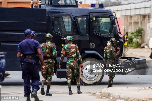 Angolan soldiers are seen during an anti-government demonstration in Luanda on October 24, 2020. - Angolan anti-riot police, some mounted on horse...