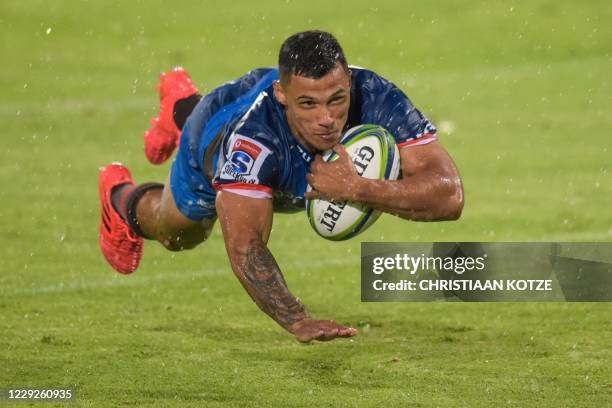 Bulls' Embrose Papier dives across the line to score a try during the third round match in the South African Super Rugby Unlocked competition between...