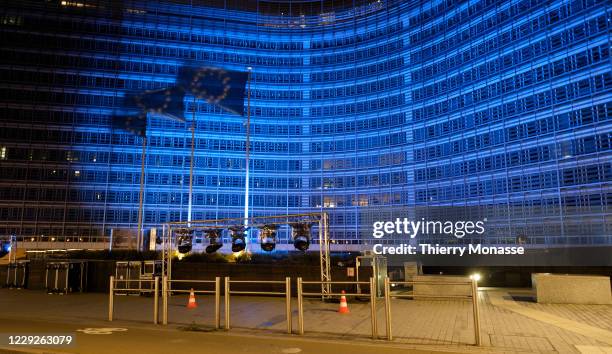 The Berlaymont, the EU Commission headquarters, is lit in blue for the 75 anniversary of the UN, on October 24 in Brussels, Belgium. The United...