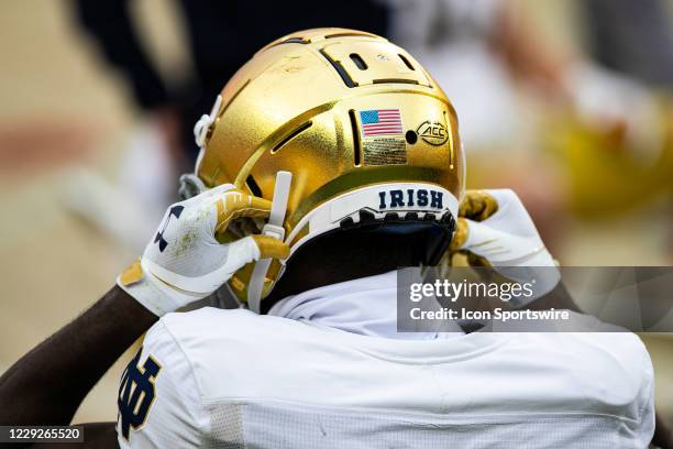 Notre Dame Fighting Irish player straps his helmet up during the college football game between the Notre Dame Fighting Irish and the Pittsburgh...
