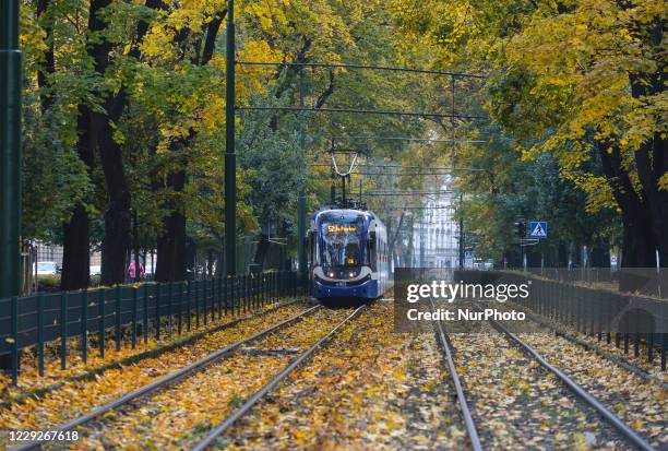 Tram' seen in Krakow's center. Starting today, October 24, new and stricter governmental restrictions will come into effect to contain the spread of...