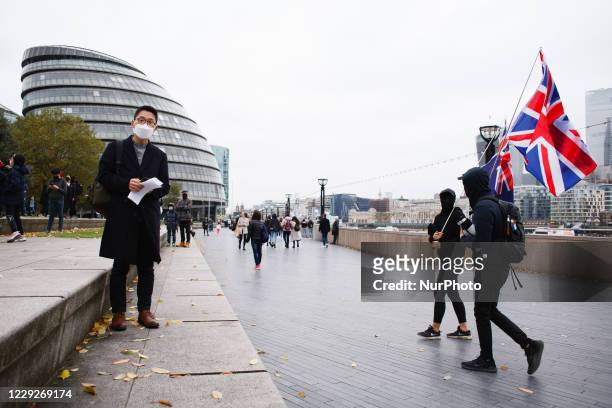Exiled Hong Kong pro-democracy activist Nathan Law waits for the start of a 'Save 12 HK Youths' rally at Potters Fields Park beside Tower Bridge in...