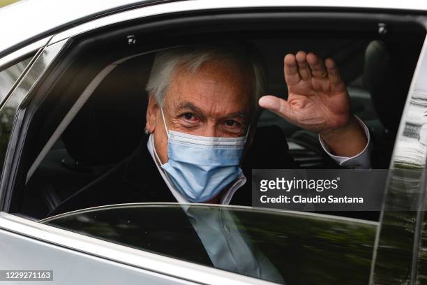 Chilean president Sebastian Piñera waves to the press after voting in the Constitutional Referendum on October 25, 2020 in Santiago, Chile. A year on...