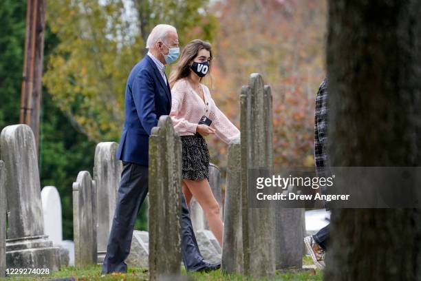 Democratic presidential nominee Joe Biden walks with his granddaughter Natalie Biden as they arrive for Sunday mass at St. Joseph on the Brandywine...