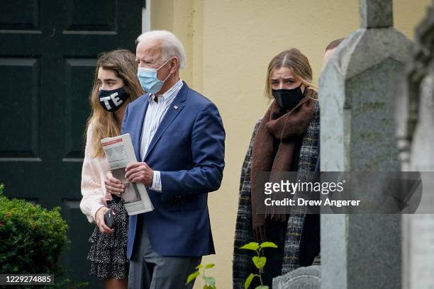 Democratic presidential nominee Joe Biden walks with granddaughter Natalie Biden and Finnegan Biden as they leave Sunday mass at St. Joseph on the...