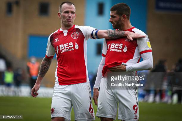 Glenn Whelan of Fleetwood Town and Ched Evans of Fleetwood Town celebrate their victory during the Sky Bet League 1 match between Gillingham and...