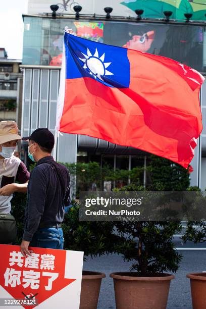 Protester holds a slogan ''CCP you're done'' during the march to demand the release of 12 Hong Kong detainees in Taipei, Taiwan, on October 25, 2020....