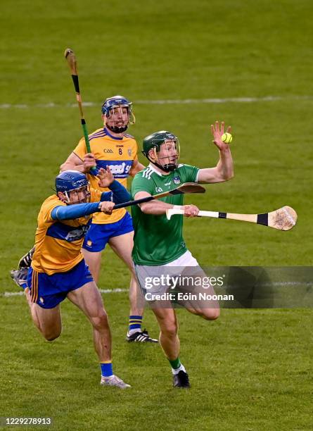 Tipperary , Ireland - 25 October 2020; William ODonoghue of Limerick is tackled by Shane O'Donnell of Clare during the Munster GAA Hurling Senior...