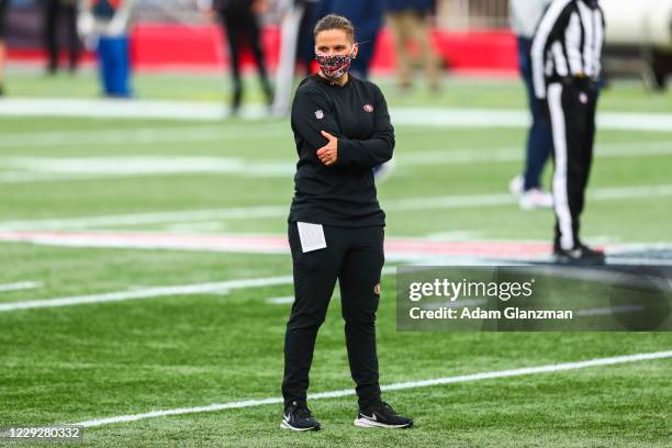 Coach Katie Sowers of the San Francisco 49ers looks on before a game against the New England Patriots on October 25, 2020 in Foxborough,...
