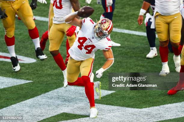 Kyle Juszczyk of the San Francisco 49ers reacts after scoring a touchdown during the first half of a game against the New England Patriots on October...