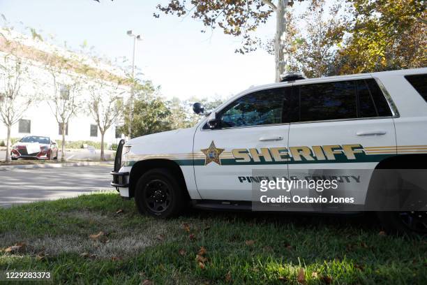 Pinellas County Sheriff Deputy is parked outside of the County Supervisor of Elections Office on October 25, 2020 in St Petersburg, Florida. The...