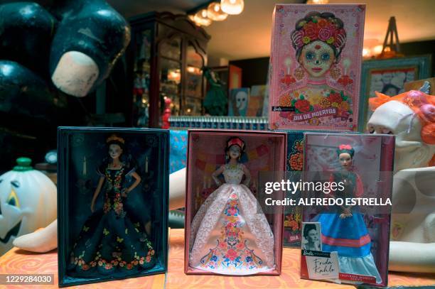 View of two Catrina Barbie dolls and a Frida Kahlo one at the Museum of the Old Mexican Toy in Mexico City on October 20, 2020. - For second year in...