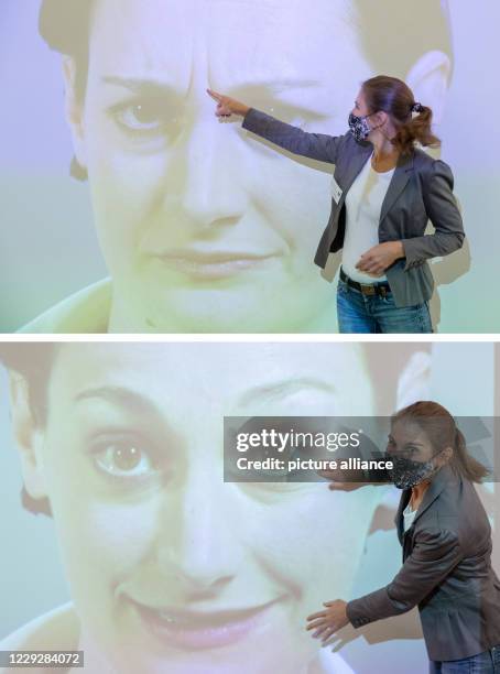 October 2020, Bavaria, Nuremberg: KOMBO: Luna Mittig explains details of facial expressions and gestures in a video installation in the Museum of...