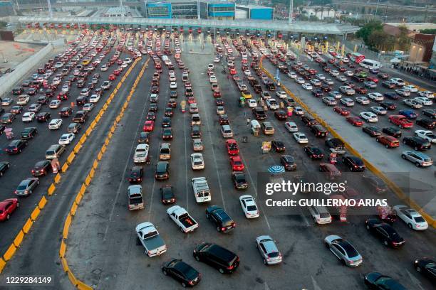 Aerial view of cars lining up to cross the US/Mexico border to San Diego at San Ysidro port of entry, in Tijuana, Baja California state, Mexico, on...