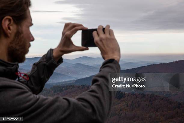 Hikers are seen walking in a forest amid Covid-19 pandemic in Beskidy mountains in the south of Poland on October 24, 2020. Since Saturday, October...