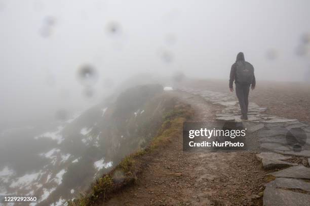 Hikers are seen walking in a forest amid Covid-19 pandemic in Beskidy mountains in the south of Poland on October 24, 2020. Since Saturday, October...