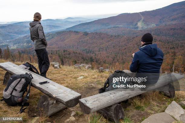 Hikers are seen walking in a forest amid Covid-19 pandemic in Beskidy mountains in the south of Poland on October 24, 2020. Since Saturday, October...