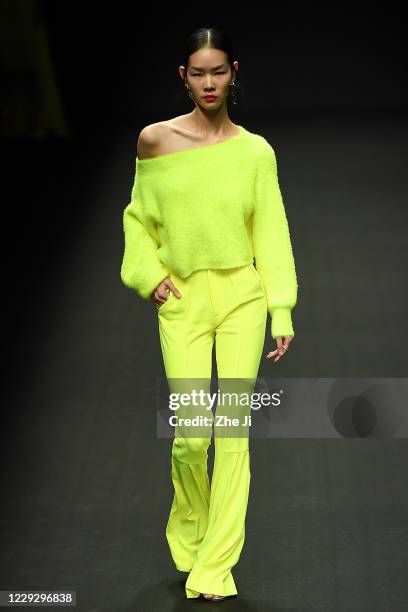 Model walks the runway during the YOUG X collection show by Chinese designer Xing Yong on day three of China Fashion Week at 751D.PARK on October 26,...