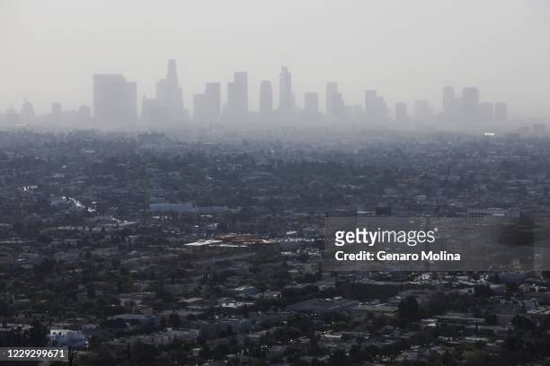 Smoke from the Silverado fire in Orange County shrouds the Los Angeles skyline as seen from the Griffith Observatory on October 26, 2020 in Los...
