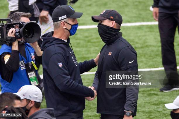 Indianapolis Colts head Coach Frank Reich shakes hands with Cincinnati Bengals Head Coach Zac Taylor after game action during a NFL game between the...