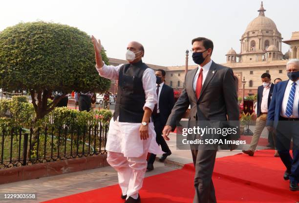 Defense Secretary Mark Esper and Indian Defence Minister, Rajnath Singh wearing face masks review a joint military guard of honour during a...