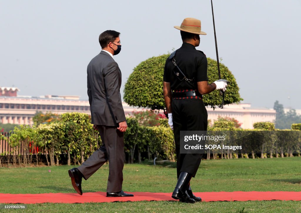 U.S. Defense Secretary Mark Esper wearing a face mask...