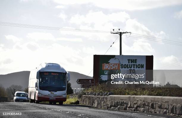 Southern Irish Bus Eireann passenger bus passes a fresh anti-Brexit billboard as it crosses the border between Ireland and the United Kingdom on...