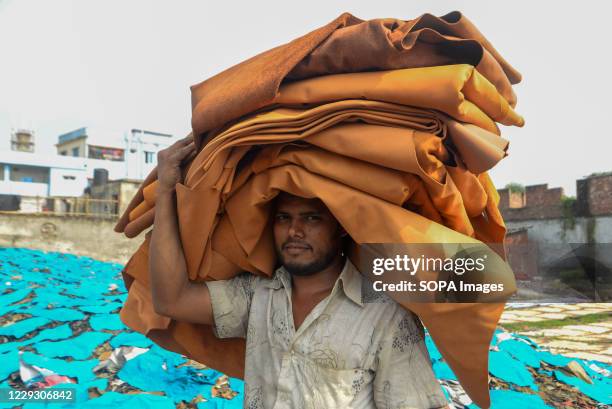 Man seen working at a tannery factory in Hazaribagh. Most people in this area have become victims of pollution due to the presence of toxic...