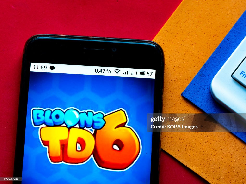 In this photo illustration a Bloons TD 6 Video game logo...