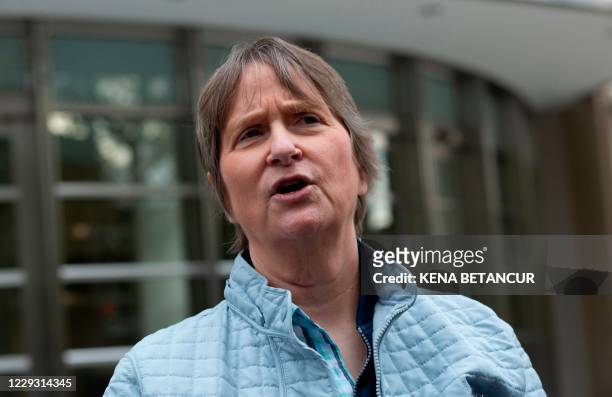 Susan Dones, former NXIVM member later sued by the organization, speaks to reporters as she leaves the Brooklyn federal court after Rainiere was...