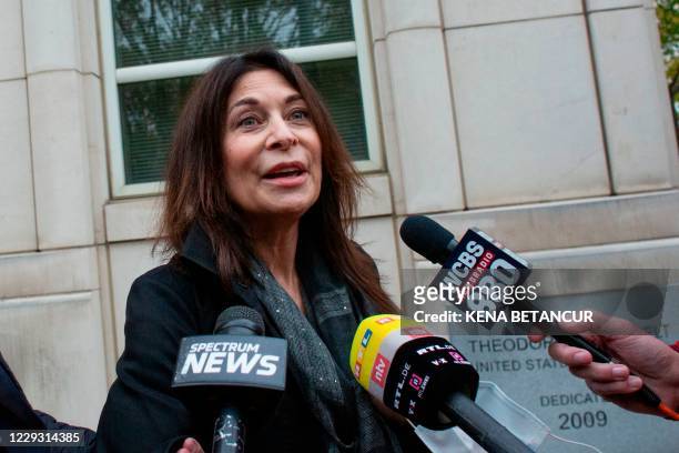 Toni Natalie, one of Keith Rainiere's ex-girlfriends and survivor of the NXIVM cult, speaks to reporters as she leaves the Brooklyn federal court...
