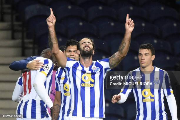 Porto's Portuguese midfielder Sergio Oliveira celebrates his goal during the UEFA Champions League group C football match between FC Porto and...