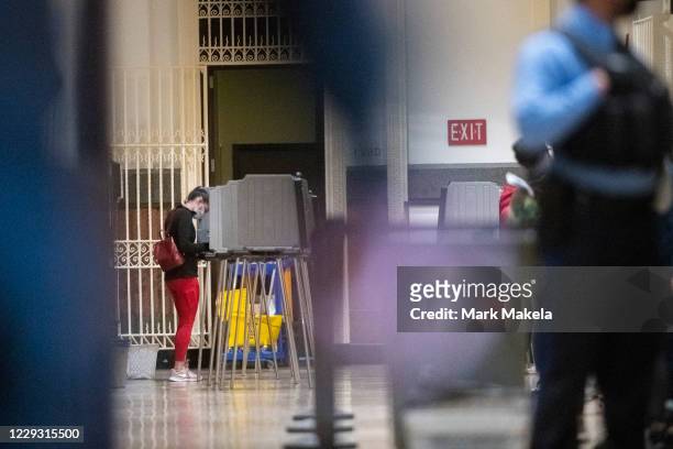 Woman casts her ballot at Philadelphia City Hall on the final day to vote early at a satellite polling station on October 27, 2020 in Philadelphia,...