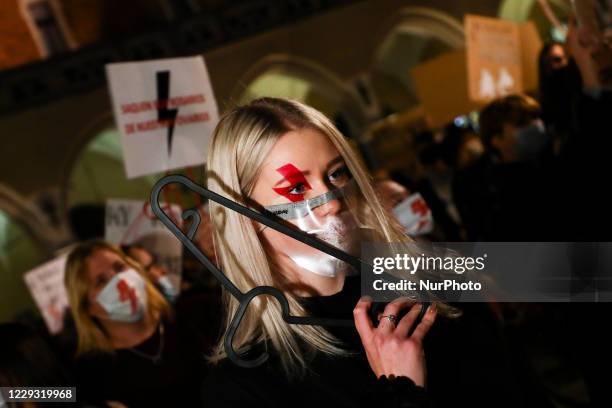 People demonstre at the Main Square during another day of the protests against restrictions on abortion law in Poland.Krakow, Poland on October 27,...