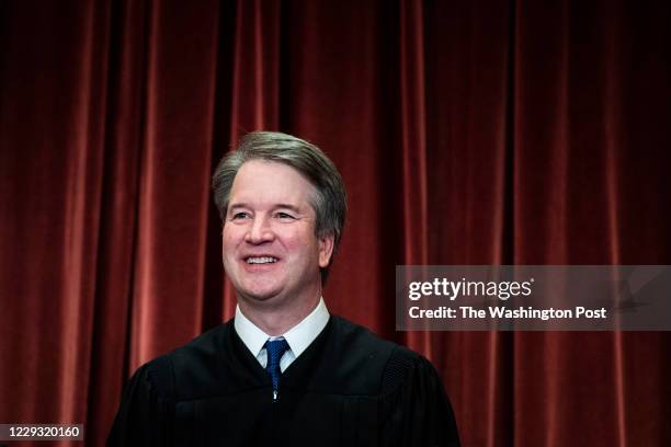 Associate Justice Brett M. Kavanaugh poses with other Justices of the United States Supreme Court during their official group photo at the Supreme...