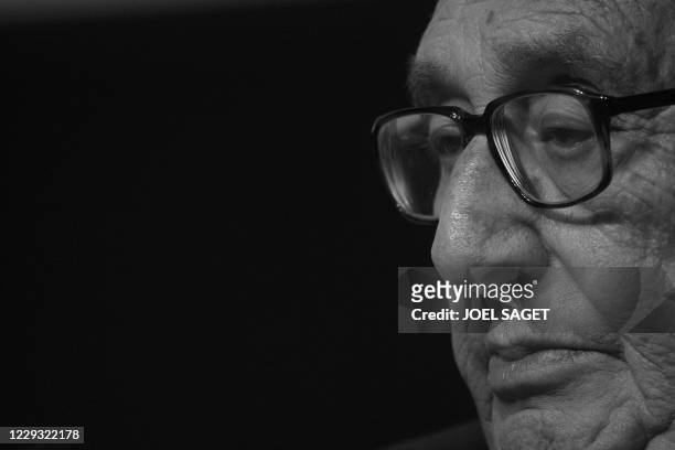Henry Kissinger, co-chair of the 2008 WEF edition listens while attending the session "Orchestrating a new concert of powers" at the World Economic...