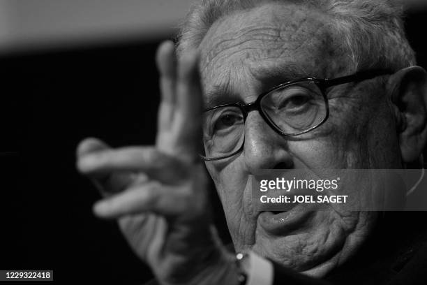Henry Kissinger, co-chair of the 2008 WEF edition listens while attending the session "Orchestrating a new concert of powers" at the World Economic...