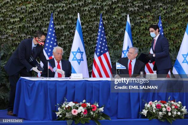 Ambassador to Israel David Friedman and Israeli Prime Minister Benjamin Netanyahu attend the signing of an extension of the Israeli-US scientific...