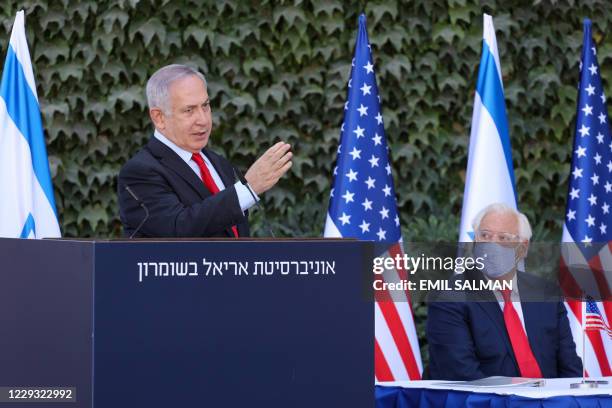 Ambassador to Israel David Friedman listens to a speech by Israeli Prime Minister Benjamin Netanyahu during a ceremony for the signing of an...