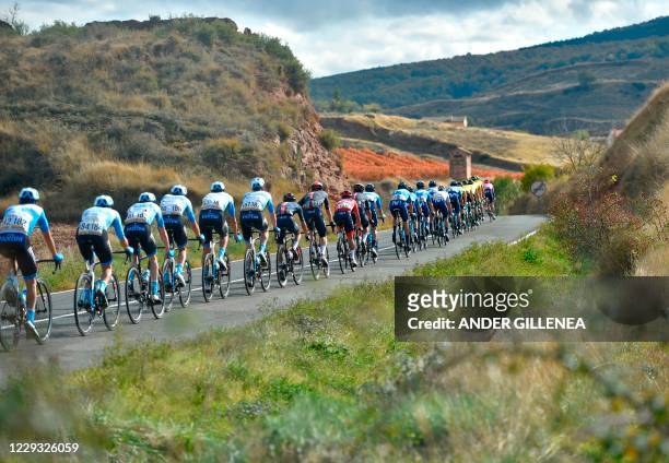 The pack rides in Ventosa during the 8th stage of the 2020 La Vuelta cycling tour of Spain, a 164 km race from Logrono to Alto de Moncalvillo, on...