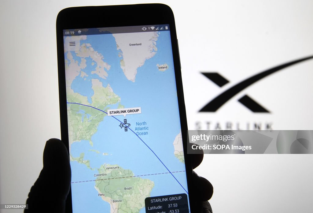 A satellite tracker image is seen displayed on a smartphone...