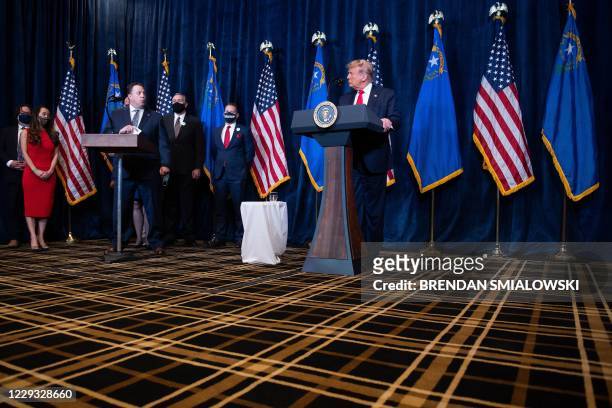 President Donald Trump listens while receiving industry endorsements at the Trump International Hotel Las Vegas October 28 in Las Vegas, Nevada.