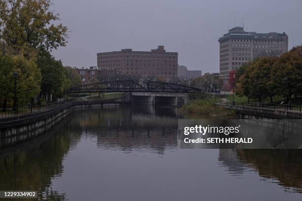 The Flint River flows past downtown Flint, Michigan October 22,2020. Flint, Michigan residents are still working through a water crisis and dealing...
