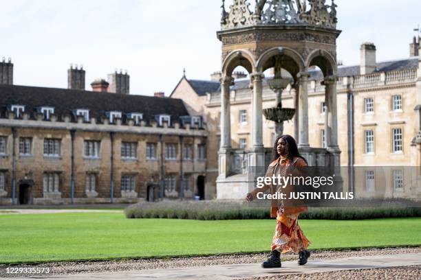 Cambridge law student Wanipa Ndhlovu walks across the Great Court at Trinity College, part of the University of Cambridge, in Cambridge, east England...