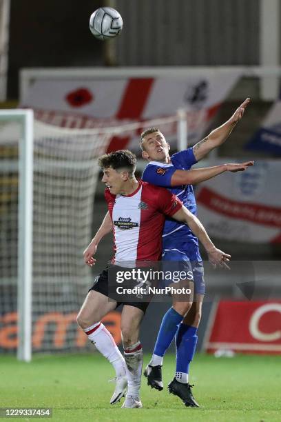 Tom Peers of Altricham in action with Claudio Ofosu of Hartlepool