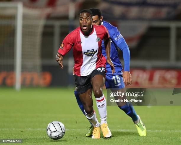 Tom Peers of Altricham in action with Claudio Ofosu of Hartlepool