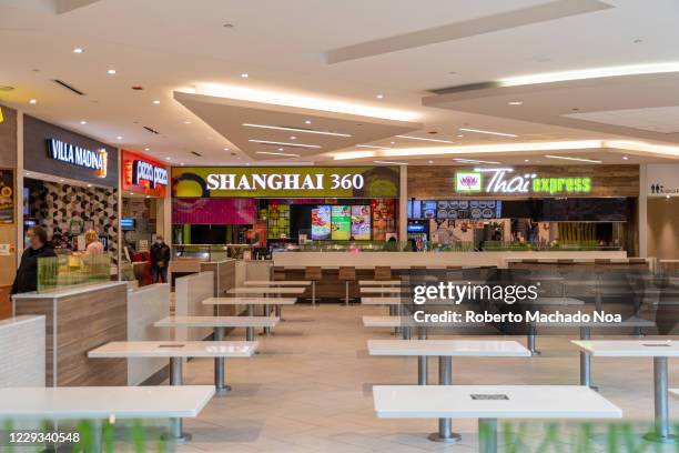 Tables without chairs in the Dufferin Mall food court during the Coronavirus pandemic. Safety measures to avoid the spread of the virus.