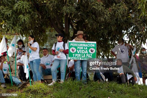 Former members of guerrilla group FARC-EP wait to begin the march to Bogotá to demand compliance of peace deal signed with national government on...