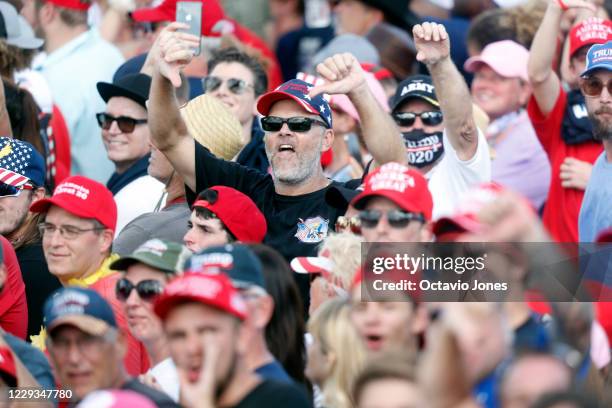 Supporters of President Donald Trump show their disdain shouting CNN sucks during his campaign speech just four days before Election Day outside of...